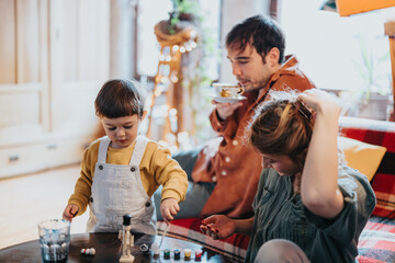A family includes a young child exploring toys and two adults relaxing in a warm and inviting living room. The setting promotes creativity, learning, and quality family time together.