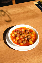 Turkish-style meatball stew with chickpeas and potatoes. tomato-based. homemade dish.