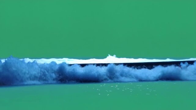 Ocean Waves Against Green Screen: Capturing the dynamic energy of the ocean's waves with artistic prowess and the versatility of a blank canvas for creative compositions.