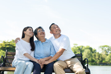 Daughter lovingly supports her elderly mother, capturing a beautiful family portrait filled with happiness and care. Their strong relationship creates cherished memories, celebrating warmth of family