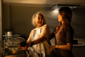 In the kitchen at home, a senior adult and their daughter cook together, sharing love and care. Their closeness strengthens their family relationship, creating lasting memories while embracing health