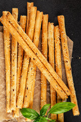 Grissini breadsticks whole grain cereal fresh delicious gourmet food background on the table rustic food top view copy space