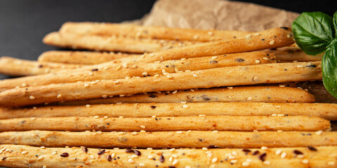 Grissini breadsticks whole grain cereal fresh delicious gourmet food background on the table rustic food top view copy space