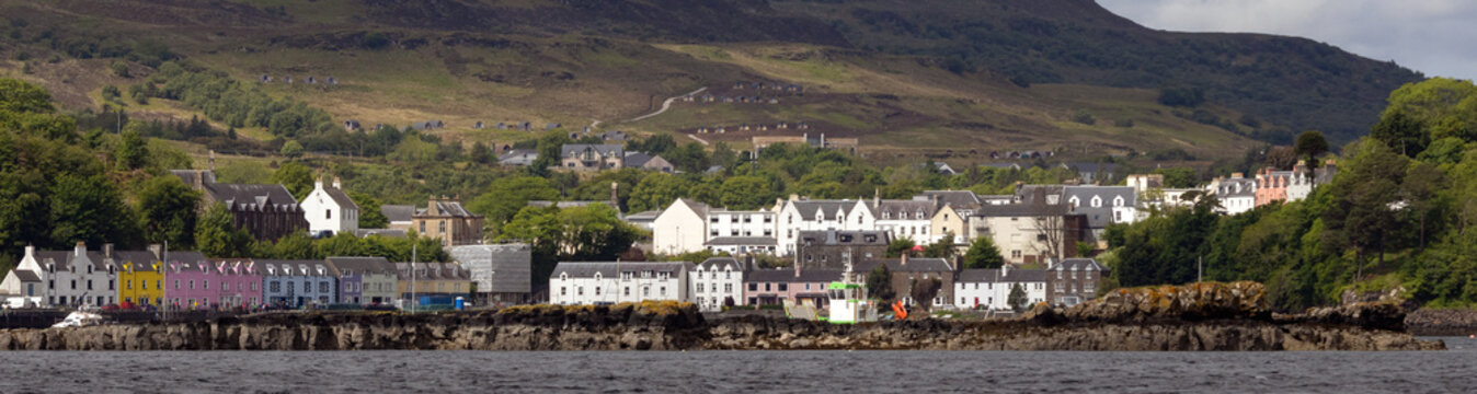 Panoramic view to colorful houses at the port of Portree, Isle of Skye, Scotland