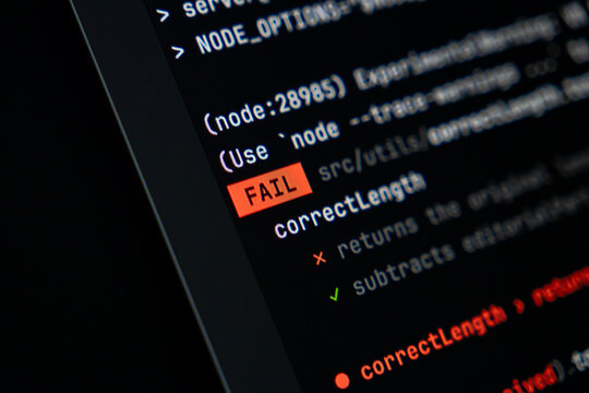 Programming code displaying a prominent red FAIL message on a dark computer screen, illustrating a critical software development error, system failure, or debugging challenge