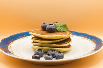 pancakes with blueberries and honey