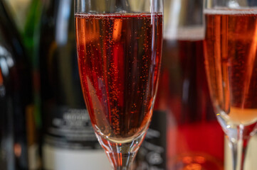 Pouring and tasting of rose or pink cuvee sparkling wine brut, grand reserve, champagne in Ay-Champagne wine making village in Vallee de la Marne, , Champagne region, France