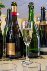 Pouring and tasting of dry sparkling wine brut, grand reserve, champagne in Ay-Champagne wine making village in Vallee de la Marne, , Champagne region, France