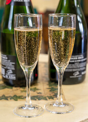 Pouring and tasting of dry sparkling wine brut, grand reserve, champagne in Ay-Champagne wine making village in Vallee de la Marne, , Champagne region, France