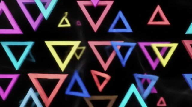 Vibrant abstract background featuring a dynamic pattern of colorful, glowing triangular shapes floating randomly on a dark backdrop.