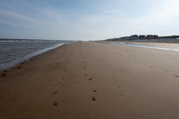 White sandy beach in cosy seaside holiday village on North Sea, built in belle epoque style in...
