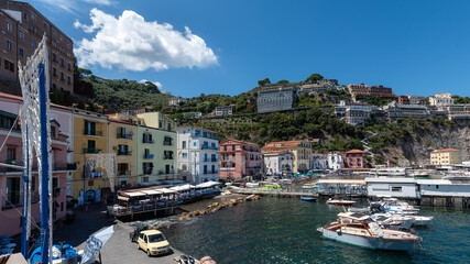 Marina Grande beach in Sorrento on a sunny summer day during Saint Anna celebrations, with festive...