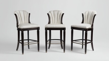 A pair of black and white leather bar stools