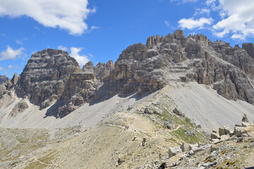 High-angle view of south tyrolean alpine landscape against blue sky. Flat hiking trails are...