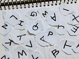 Torn Alphabet Scraps on Spiral Notebook Creative Typography Concept Education Learning and Artistic...