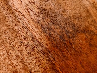 Warm Mahogany Wood Grain Texture with Intricate Patterns and Rich Brown Tones.