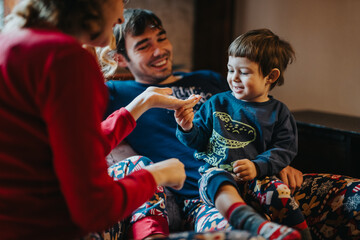 A cheerful family shares quality time together at home, creating warm and joyful memories in a...