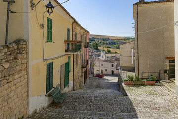 A narrow street among the old houses of Salcito, a small town in the province of Campobasso, Italy.