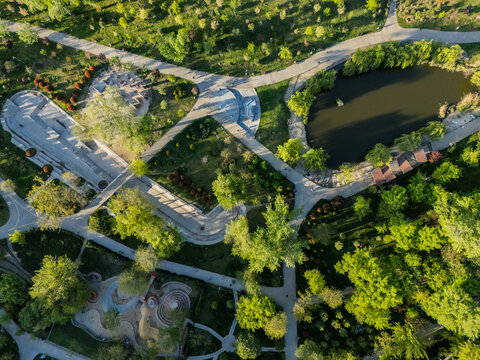 Aerial view of Mziuri Park's winding paths, lush greenery, and tranquil pond, a vibrant tapestry of nature and recreation, Tbilisi, Tbilisi, Georgia.