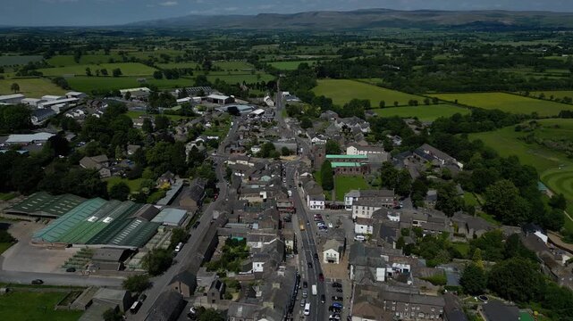 4K: Aerial Drone Video of Kirkby Stephen in Cumbria, England, UK. Approach shot of the Town Centre. Stock Video Clip Footage