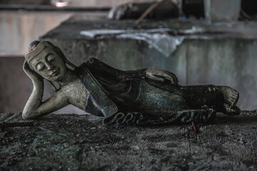  Old broken statue in abandoned hotel. Shabby statue. Scary abandoned hotel. Dirty item.