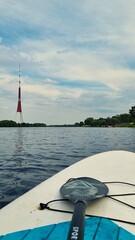 Summer Paddleboarding on the Daugava River with View of Riga TV Tower