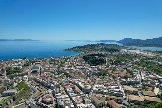Fototapeta Aerial view of the city stretching towards the sea, where the old fortress stands guard, Corfu, Corfu, Greece.