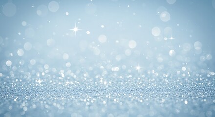 Soft blue bokeh lights and sparkles create a magical, festive background