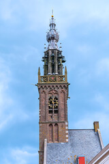 Beautiful Leaning Carillon Tower (De Speeltoren) of the old Church of Our Lady, tilting over Kleine Kerkstraat. The tower was constructed in the 15th and 16th centuries. EDAM, NETHERLANDS.
