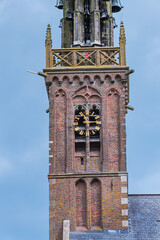 Beautiful Leaning Carillon Tower (De Speeltoren) of the old Church of Our Lady, tilting over Kleine Kerkstraat. The tower was constructed in the 15th and 16th centuries. EDAM, NETHERLANDS.