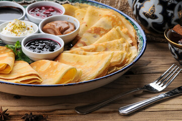 pancakes on a plate with various jams