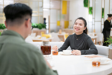 Man and woman having dinner together in restaurant