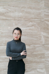 Beautiful woman wearing glasses looking at the camera confidently