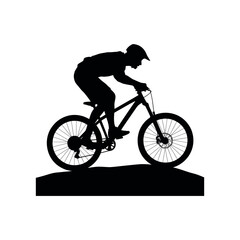 Black silhouette of a mountain biker riding on a dirt path cyclist biking
