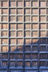 Venetian natural wood grid tiled side door of Basilica Santa Maria Gloriosa dei Frari