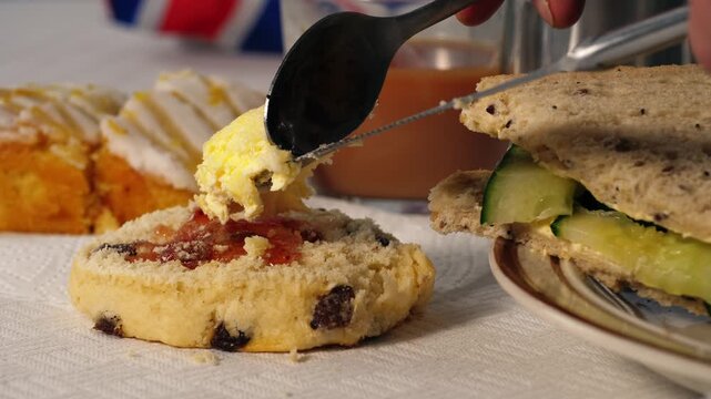Traditional English tea with scone clotted creams and cucumber sandwiches