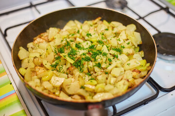 Fried Potatoes with Dill on Stove