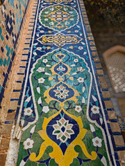 Islamic geometric ornament with blue and green floral tilework