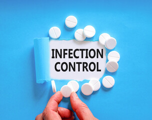 Infection control symbol. Concept words Infection control on beautiful white paper. White pills...