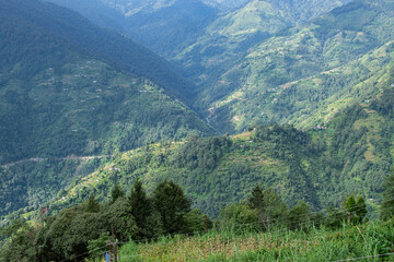 Sun rays falling on Himalayan mountain range, scenic beauty of layers of mountains, Okhrey, sikkim,...