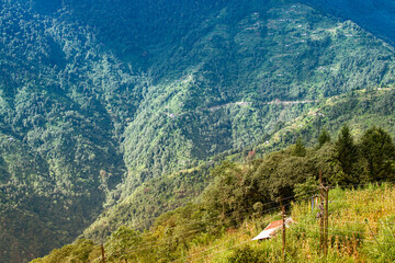 Beautiful Sun rays falling on Himalayan mountain range, play of light, scenic beauty of Okhrey,...