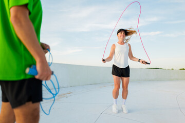 Joyful jumper enjoying an energetic workout in a vibrant outdoor space