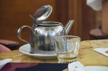 Argentina. Traditional tea pot and glass at a restaurant table in Argentina