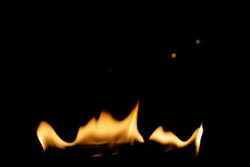 Flames Dancing in Darkness with Soft Glows of Light