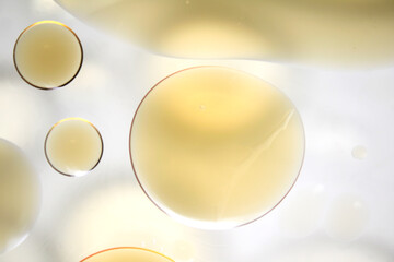 Close-Up View of Colorful Oil Drops on Water Surface Background