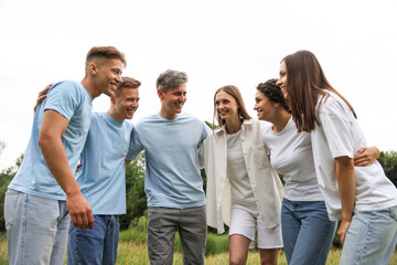 Obraz premium Team building. Group of happy people together outdoors