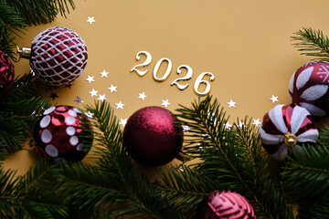 Yellow New Year's background with the number of the coming year 2026.