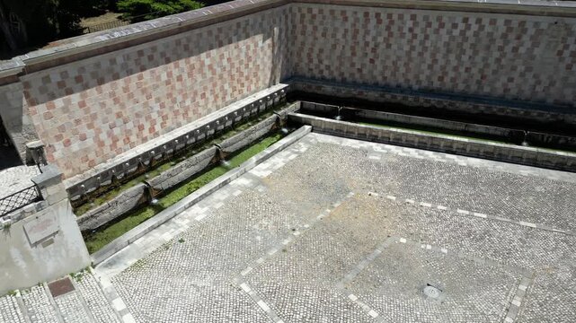 Italy, July 10, 2025: Aerial view of the Fountain of the 99 Spouts (also known as the Rivera Fountain), a monumental fountain in L'Aquila, included in the list of Italian national monuments