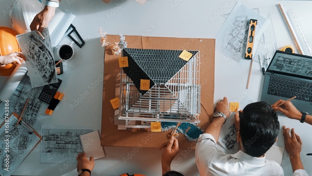 Poster top down aerial view of manager talk about building construction at meeting table with house model. 