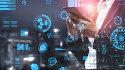 A businessman engaged with a smartphone while surrounded by floating data visuals and analytics, set against a night city skyline showcasing modern technology trends. Xenic